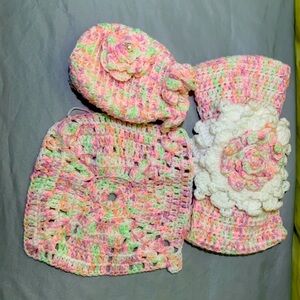 I am selling a pinkish color purse, bow, and little tiny blanket.